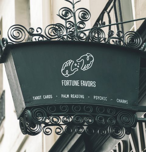fortune favors hand lineart logo mockup on shop sign