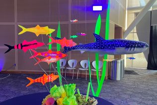 whale shark black light sculpture art installation